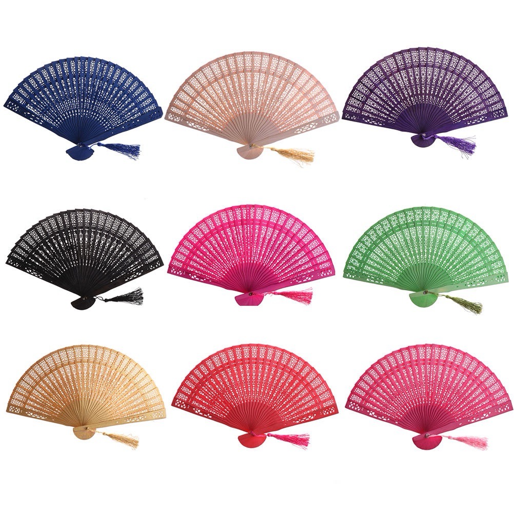 A collection of colorful carved wooden folding fans displayed against a white background